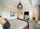 Bright bedroom with neutral tones, tray ceiling, stylish light fixture, and modern furniture at 3918 Dahlia Dr # 15, Harrisburg, NC 28075