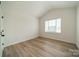 Bedroom featuring a vaulted ceiling, wood flooring and a window at 3918 Dahlia Dr # 15, Harrisburg, NC 28075