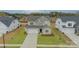 Charming two-story home with a well-manicured lawn and inviting front entrance at 3918 Dahlia Dr # 15, Harrisburg, NC 28075