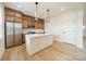 Modern kitchen featuring a large island, stainless steel appliances, and custom cabinetry at 3918 Dahlia Dr # 15, Harrisburg, NC 28075