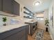 Functional laundry room with modern appliances, ample storage, and stylish decor at 3918 Dahlia Dr # 15, Harrisburg, NC 28075