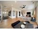 Open-concept living space with modern decor, wood floors, and abundant natural light at 3918 Dahlia Dr # 15, Harrisburg, NC 28075