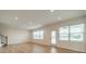 Living room filled with natural light from windows and a glass patio door at 3918 Dahlia Dr # 15, Harrisburg, NC 28075