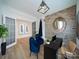 Home office with modern brick accent wall and two blue chairs at 3918 Dahlia Dr # 15, Harrisburg, NC 28075