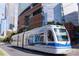 Street view of the Lynx light rail train with Spectrum Center in the background at 411 Cemetery St, Charlotte, NC 28216