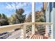 Balcony overlooks a tree-lined street and a blue sky at 474 New Bern Station Ct, Charlotte, NC 28209