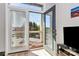 Balcony view through an open door with blinds in a room with wood-look flooring at 474 New Bern Station Ct, Charlotte, NC 28209