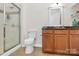 Bathroom features a glass shower door, vanity, and neutral tile floors at 474 New Bern Station Ct, Charlotte, NC 28209