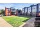 View of a brick multi-Gathering exterior with a well-manicured lawn at 474 New Bern Station Ct, Charlotte, NC 28209