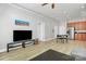 Spacious open-concept area with wood floors connecting the living, dining, and kitchen areas at 474 New Bern Station Ct, Charlotte, NC 28209