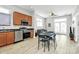 Open kitchen and living room area with stainless steel appliances at 474 New Bern Station Ct, Charlotte, NC 28209