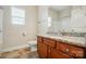 Bathroom features a granite vanity top, tile flooring, window with blinds, and a toilet at 5032 Eagles Crest Ln, Gastonia, NC 28056