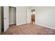 Carpeted bedroom featuring a closet and a door that opens to another room at 5032 Eagles Crest Ln, Gastonia, NC 28056