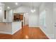 Cozy breakfast nook with wood floors, pendant lighting, and a view of the kitchen at 5032 Eagles Crest Ln, Gastonia, NC 28056