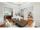 Dining room features a rustic wood table with seating and views into other rooms in the home at 5032 Eagles Crest Ln, Gastonia, NC 28056