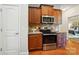 Updated kitchen with wood cabinets, granite countertops, stainless appliances, and hardwood floors throughout at 5032 Eagles Crest Ln, Gastonia, NC 28056