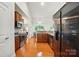Updated kitchen with wood cabinets, granite countertops, stainless appliances, and hardwood floors throughout at 5032 Eagles Crest Ln, Gastonia, NC 28056