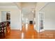 Open concept living room with wood floors and view of the kitchen and breakfast nook at 5032 Eagles Crest Ln, Gastonia, NC 28056