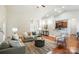 Inviting living area with hardwood floors, ample seating, and an open layout perfect for entertaining at 5032 Eagles Crest Ln, Gastonia, NC 28056