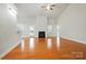 Large living room with vaulted ceilings, fireplace, and view of the breakfast nook at 5032 Eagles Crest Ln, Gastonia, NC 28056
