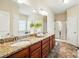 Primary bathroom features a double sink vanity with granite counters and a glass enclosed shower at 5032 Eagles Crest Ln, Gastonia, NC 28056