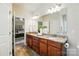 Primary bathroom features a double sink vanity with granite counters at 5032 Eagles Crest Ln, Gastonia, NC 28056