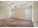 Large bedroom has carpet, natural lighting and a ceiling fan at 5032 Eagles Crest Ln, Gastonia, NC 28056