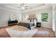 Spacious main bedroom featuring tray ceilings, neutral tones, and ample natural light for a serene retreat at 5032 Eagles Crest Ln, Gastonia, NC 28056