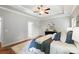 This main bedroom features a tray ceiling, neutral walls, and a luxurious bed at 5032 Eagles Crest Ln, Gastonia, NC 28056