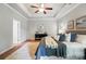 This main bedroom features a tray ceiling, neutral walls, and a luxurious bed at 5032 Eagles Crest Ln, Gastonia, NC 28056