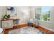 Bright office space features a desk, a chair, a lamp and a window with lots of natural light at 5032 Eagles Crest Ln, Gastonia, NC 28056