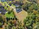 A high angle view of a home with a lush, green backyard bordering dense woods at 5039 Eliza Long Wilkie Dr, Huntersville, NC 28078