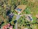 Overhead view of a neighborhood featuring modern homes with a lush, wooded backdrop at 5039 Eliza Long Wilkie Dr, Huntersville, NC 28078