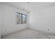 Bedroom with window and neutral walls at 5039 Eliza Long Wilkie Dr, Huntersville, NC 28078