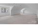 Large bonus room with neutral walls and one window at 5039 Eliza Long Wilkie Dr, Huntersville, NC 28078