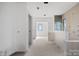 Kitchen in the process of being built featuring an island and a view from a large window at 5039 Eliza Long Wilkie Dr, Huntersville, NC 28078