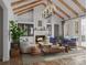 Inviting living room with vaulted ceiling, exposed beams, a cozy fireplace, and stylish furnishings at 5039 Eliza Long Wilkie Dr, Huntersville, NC 28078