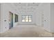 Bright living room featuring a large window and glass sliding door with views in this home at 5039 Eliza Long Wilkie Dr, Huntersville, NC 28078