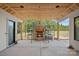 Covered patio with a brick fireplace under construction at 5039 Eliza Long Wilkie Dr, Huntersville, NC 28078