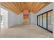 Unfinished room with a wood ceiling, a sliding glass door and a fireplace frame at 5039 Eliza Long Wilkie Dr, Huntersville, NC 28078