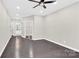 Spacious room featuring hardwood floors, recessed lighting, and sliding door closet at 6520 White Pine Ln, Charlotte, NC 28262