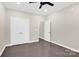 Hardwood bedroom featuring neutral walls, access to other rooms, closet, and natural light at 6520 White Pine Ln, Charlotte, NC 28262