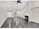 Spacious living room with fireplace and hardwood floors offers a comfortable gathering space at 6520 White Pine Ln, Charlotte, NC 28262