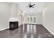 Inviting living room features a fireplace, hardwood floors, and French doors to the outside at 6520 White Pine Ln, Charlotte, NC 28262