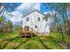 Home's exterior highlights a wooden deck overlooking the backyard at 701 Applewood St, Kannapolis, NC 28081
