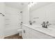 Bathroom featuring double sinks, white cabinets, modern fixtures, and a tub with shower at 701 Applewood St, Kannapolis, NC 28081