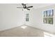 Bright carpeted bedroom with two windows providing ample natural light at 701 Applewood St, Kannapolis, NC 28081
