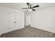 Bedroom featuring a ceiling fan, carpet, and white trim at 701 Applewood St, Kannapolis, NC 28081