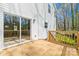 Spacious deck featuring a sliding glass door and wooden railings offers outdoor living at 701 Applewood St, Kannapolis, NC 28081