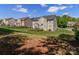 Large backyard with a well-maintained lawn, iron fence, and a patio area perfect for entertaining at 706 Springwood Dr # 14, Waxhaw, NC 28173